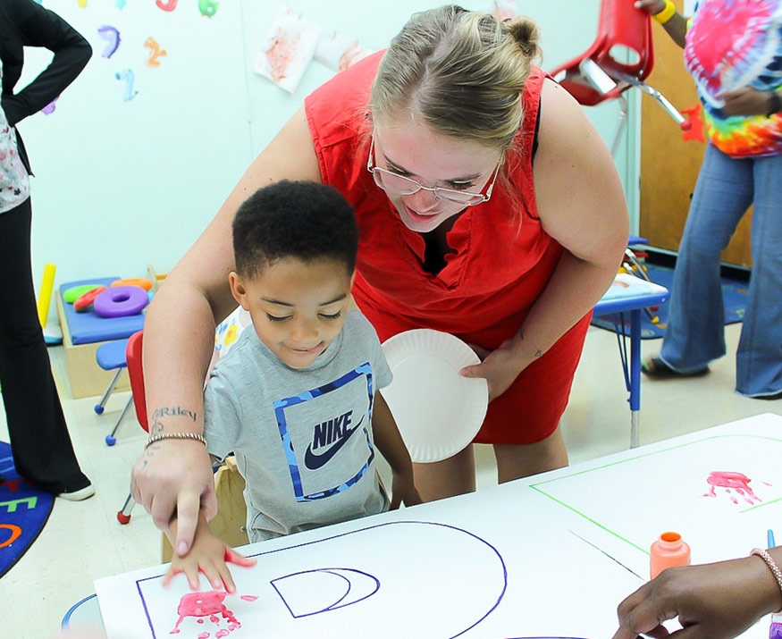 Child with teacher