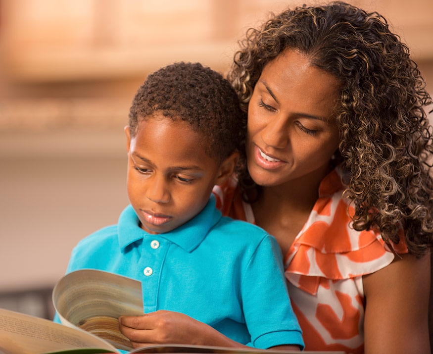 Woman with kid reading