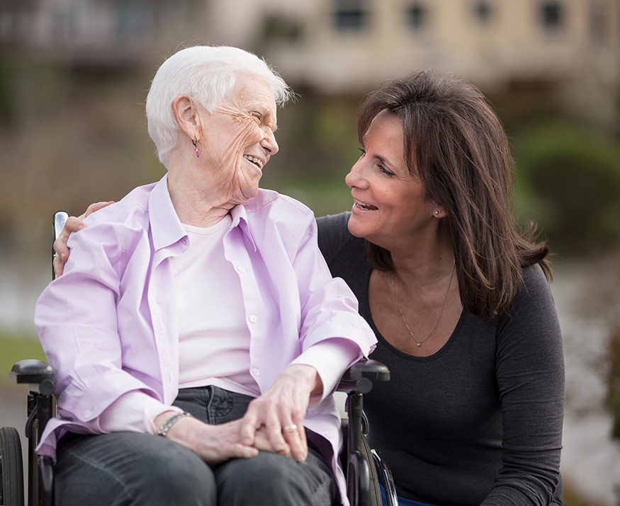 Woman with lady in wheelchair