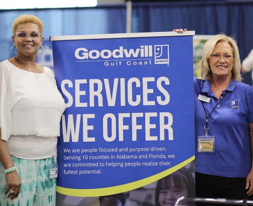 Ladies holding mission banner