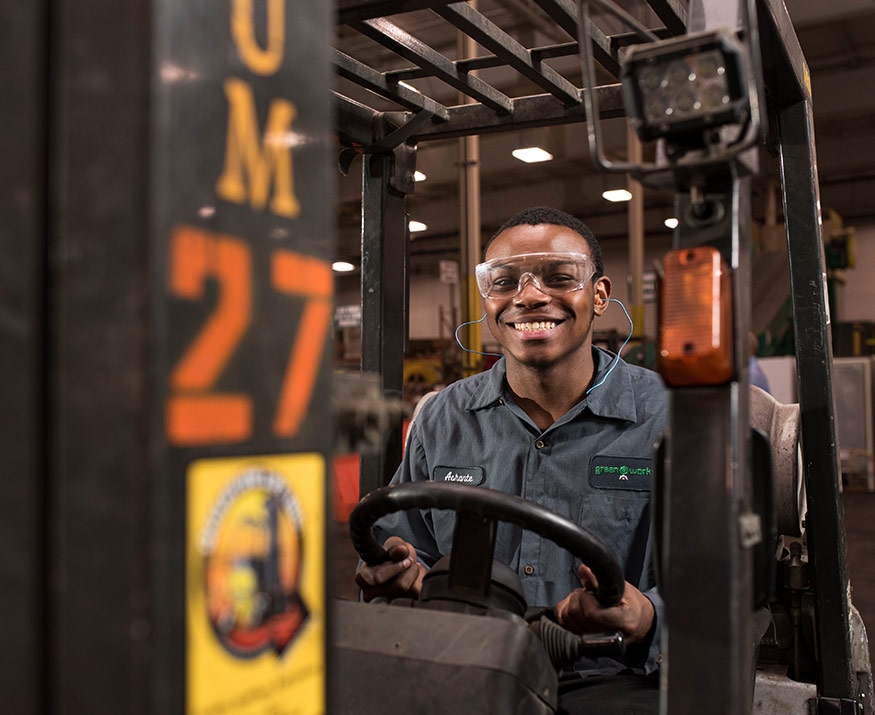 Worker on forklift